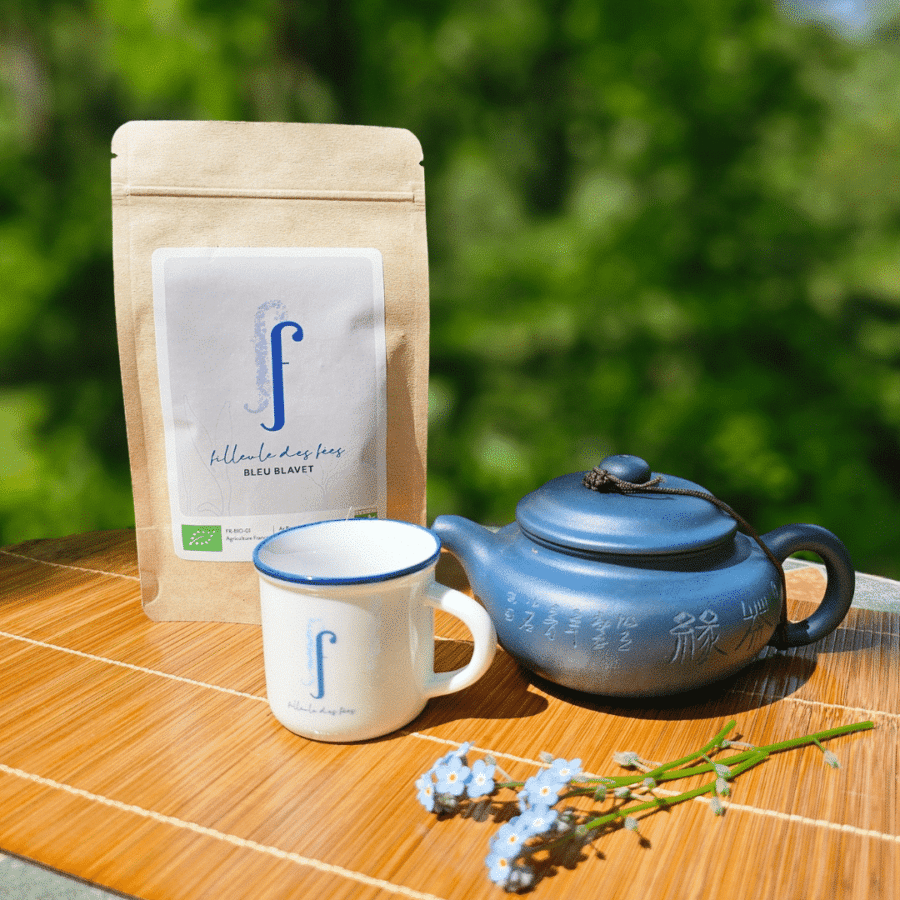 Blue tea with a blue terracotta teacup and teapot.